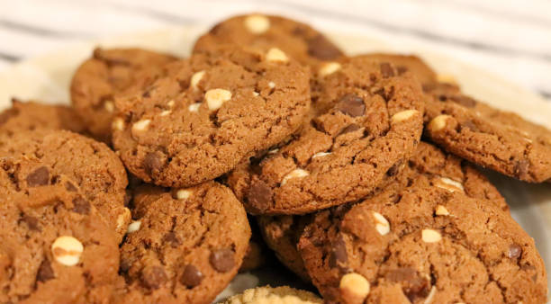 istock Delicious white and black chocolate chip cookies. 1255993192
