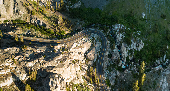 Stitched aerial panorama of a road snaking through the Sonora Pass in the California Sierra Nevada.