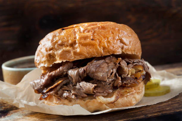 istock Roast Beef and Cheddar Sandwich with Au jus on a Toasted Onion Bun 1255995228