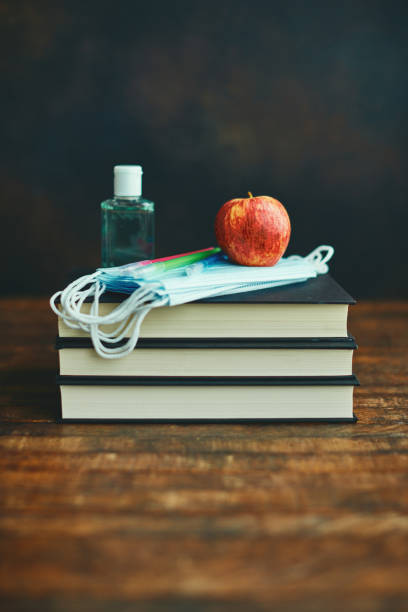 istock Back to School with Face Masks, Apple and Antibacterial Gel 1255995678