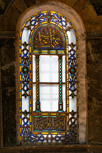 Istanbul / Turkey, September 03 2019; Ornate window view in Hagia Sophia (Ayasofya) museum. Colorful glass.