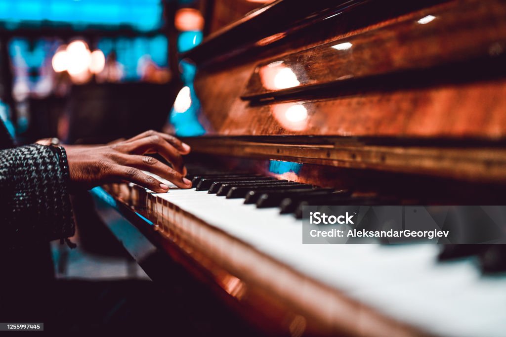 African Male Playing Beautiful Song On Piano Jazz Music Stock Photo