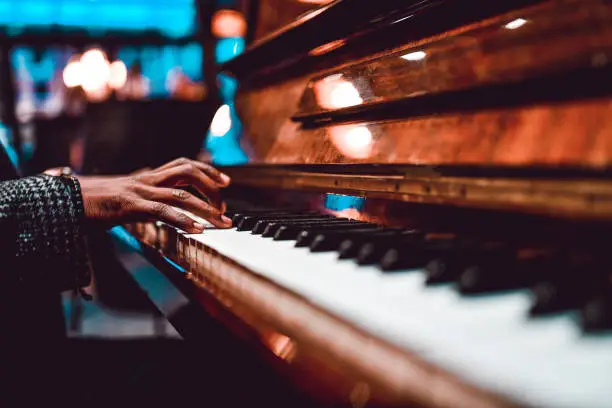 African Male Playing Beautiful Song On Piano