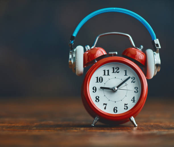 Alarm clock wearing headphones
