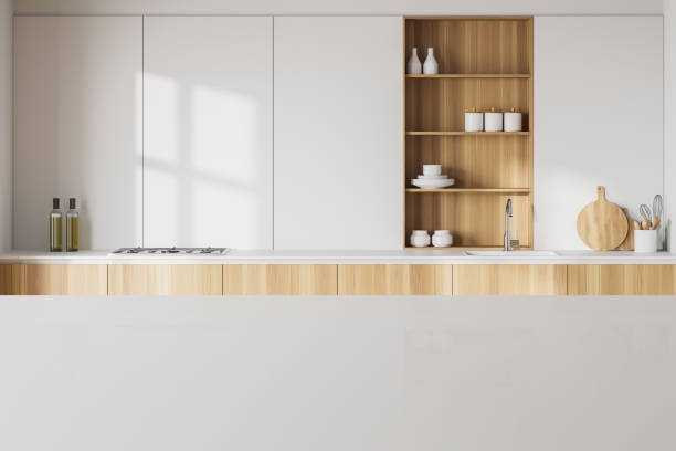 istock Table in white kitchen with wooden countertops 1255998359