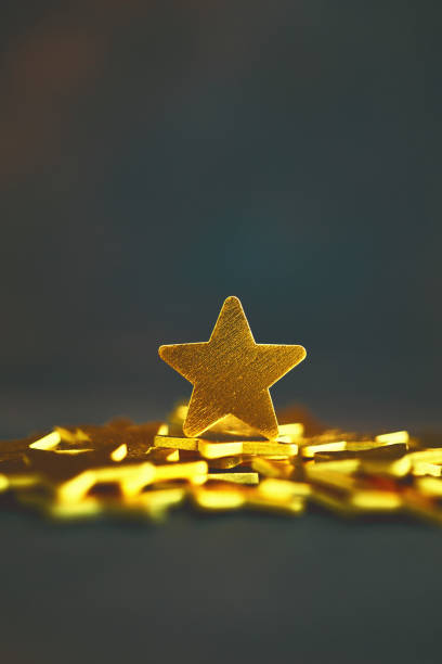 Shiny gold stars against dark background