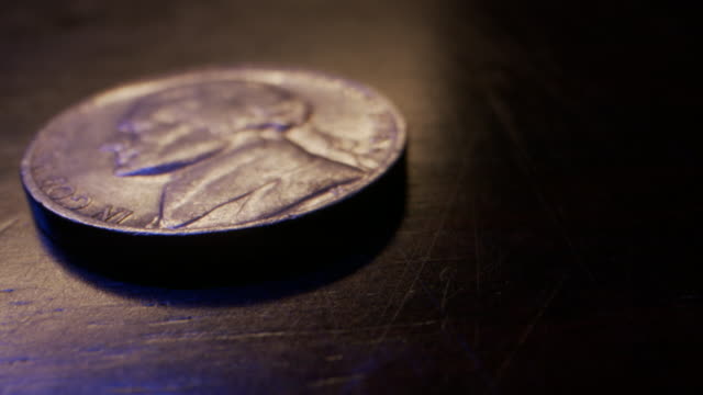 Extreme Close-Up Macro Moving Slider Shot of American Currency Nickel worth 5 Cents
