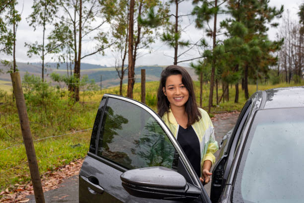 istock woman getting in the car 1256000173