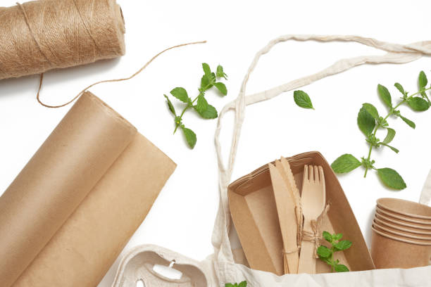 istock textile bag and disposable tableware from brown craft paper, green mint leaves 1256000220