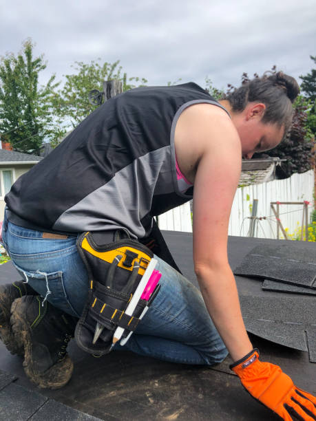 istock Roofer Woman doing some roofing 1256002217