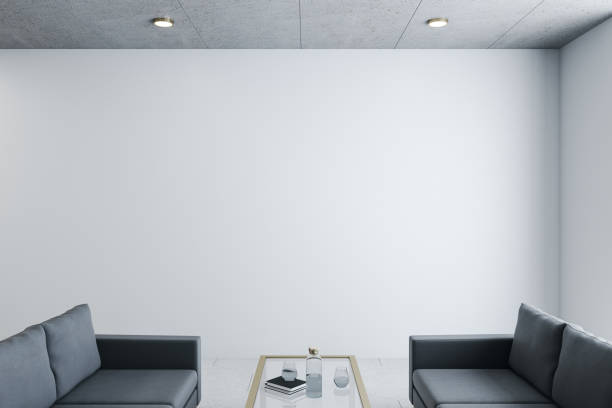 istock Modern waiting room in office with two black sofa 1256002988