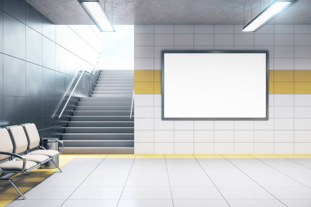 istock Chairs for waiting in modern metro station with blank poster. 1256003020