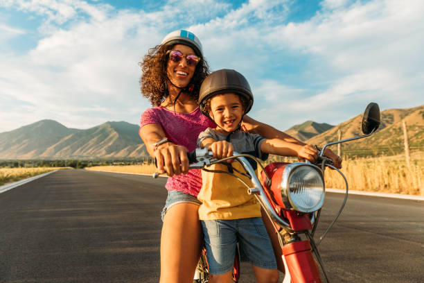istock Mother and Son Riding on Retro Scooter 1256003130