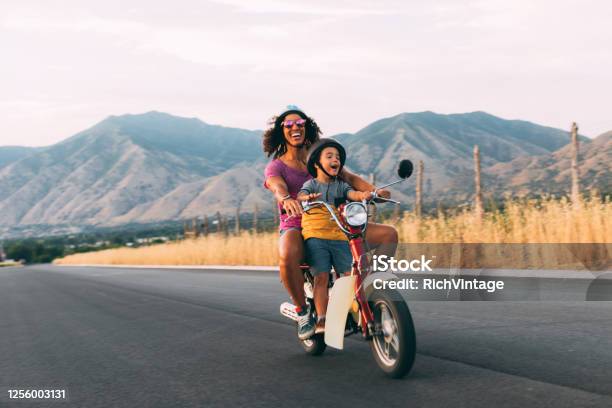 Mother And Son Riding On Retro Scooter Stock Photo - Download Image Now - Family, Moped, Travel