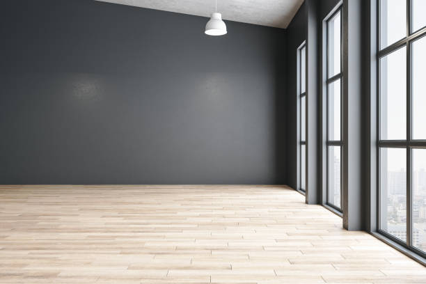 istock Contemporary gallery interior with blank gray wall 1256004142