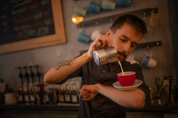 istock Barista is making espresso with milk 1256004437