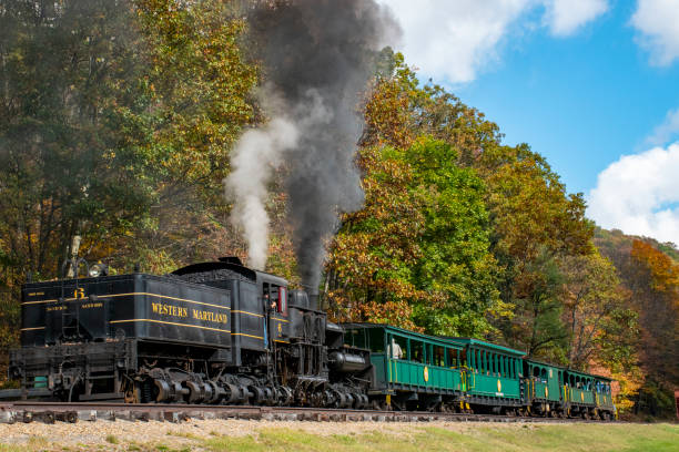 Big 6 2 A tourist train is passing by in a setting of fall colors. The train is powered by a Shay-type steam locomotive and is operating on the Cass Scenic railroad.
Cass, West Virginia, USA
10/12/2017 robertmichaud stock pictures, royalty-free photos & images