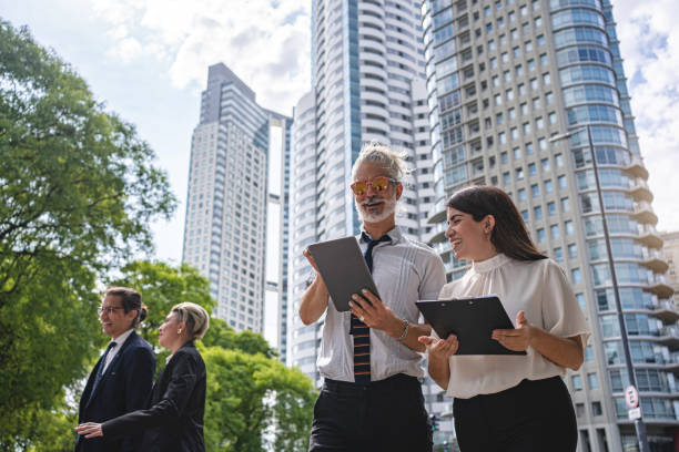 istock Business coworkers brainstorming ideas on a digital tablet after work 1256005808
