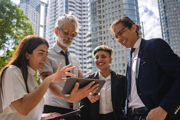 istock Business colleagues laughing while looking at a digital tablet 1256005858