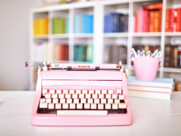 istock Modern home office with pink vintage typewriter 1256008028