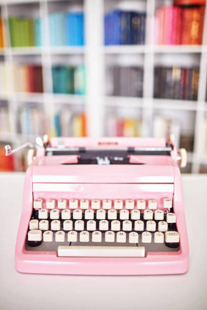 istock Modern home office with pink vintage typewriter 1256008029