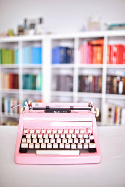 istock Modern home office with pink vintage typewriter 1256008031