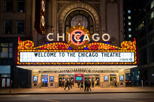 Chicago, USA - Mar 12, 2020: Early in the evening the illuminated Chicago Theater downtown in the loop.
