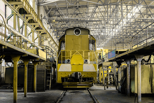 Diesel locomotive in depot on service. Railway transport.