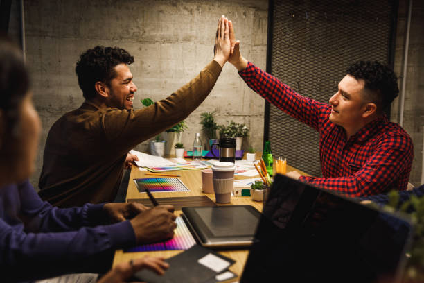 istock High five after working together to create an innovative design 1256012615