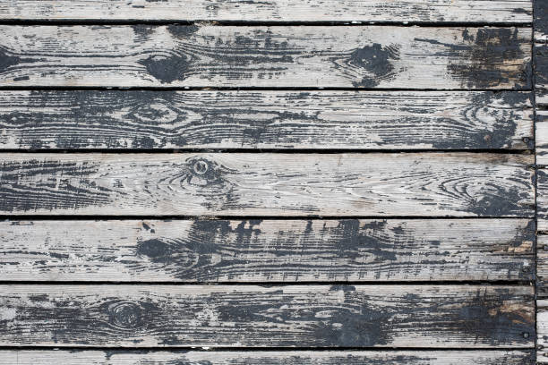 istock Weathered black and white wooden background texture. 1256012885