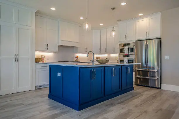 Photo of Gorgeous spark of blue among mostly white kitchen