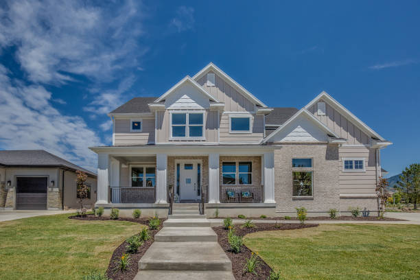 istock Traditional home with light colored exterior and side entry garage 1256017174