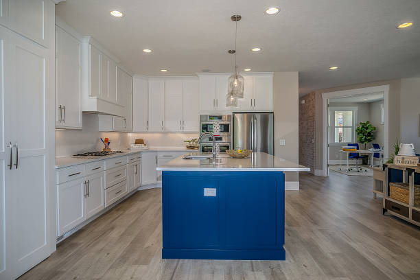 istock Gorgeous spark of blue among mostly white kitchen 1256017185