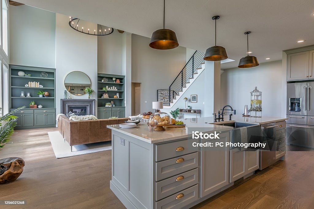 Beautiful modern kitchen with all luxuries you could want Kitchen island with gray and white colors staged for Tour Kitchen Stock Photo