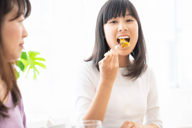 istock asian parent and daughter 1256023839
