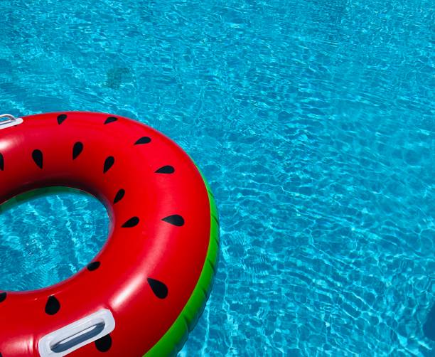 istock Inflatable watermelon in the swimming pool 1256031288