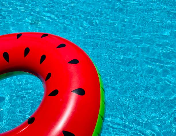 istock Inflatable watermelon in the swimming pool 1256031296