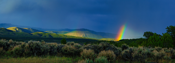 Vibrant Rainbow with Mountain Views Eagle Colorado - Scenic summer landscape after storm moved through and sun came out.