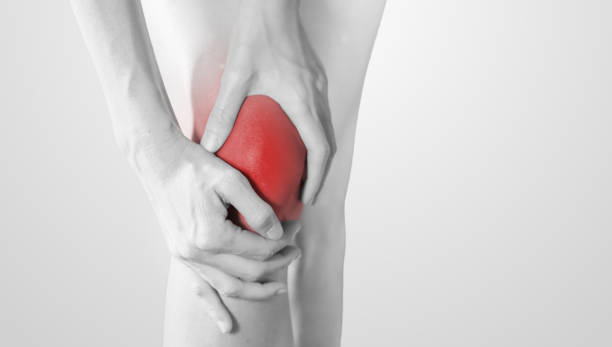 istock A woman massaging her pain knee 1256035488