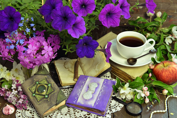 istock Romantic still life with petunia bouquet, decorated diary and cup of tea. 1256035713