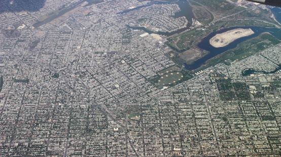 Aerial view of the residential buildings and houses of Long Island and some parts of Brooklyn from the airplane window (United States of America)