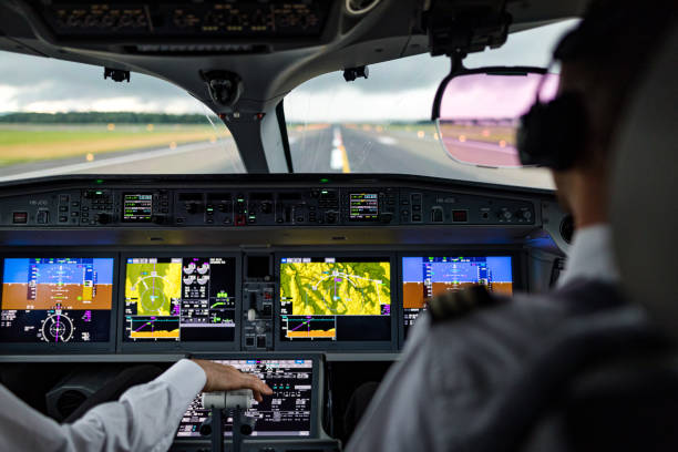 decollo sotto la pioggia dalla cabina di pilotaggio - airplane cockpit taking off pilot foto e immagini stock