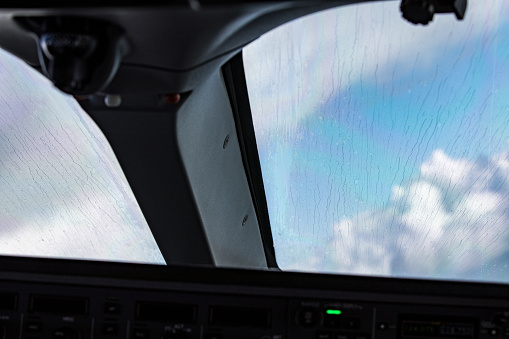 Rain drops on the cockpit windows after departure.