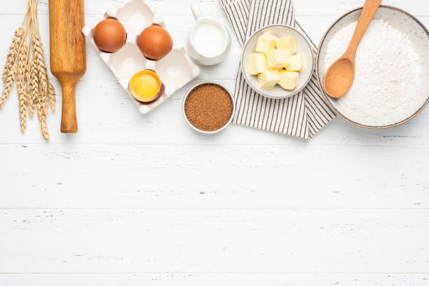 istock Ingredients for baking on white wooden table background 1256037791