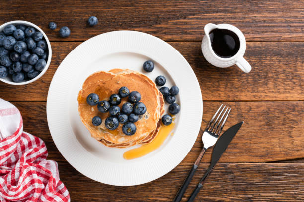 istock Pancakes with blueberries and honey 1256038881
