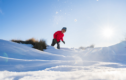Kids enjoying weekend activities in snow heading towards Mt Ruapehu, National Park, New Zealand.