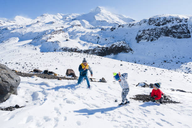 istock Father with kids snow fighting. 1256043987