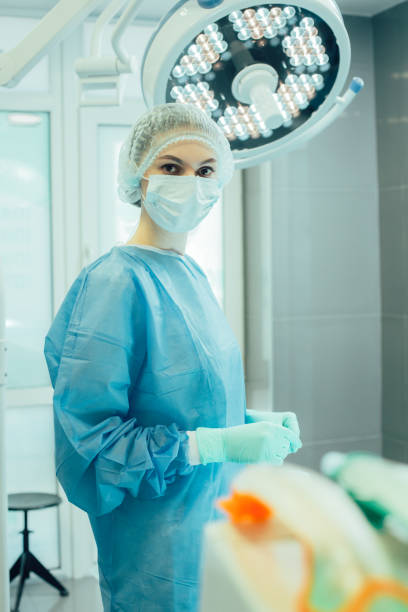 istock Serious surgeon in the operating theatre standing alone 1256051593