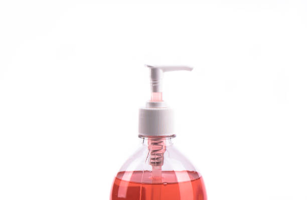 istock Red liquid soap in plastic pump bottle isolated on white background. 1256052513