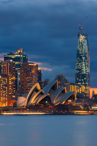 Sydney, Australia - July 11, 2020: Sydney Opera House and CBD skyline at dusk.